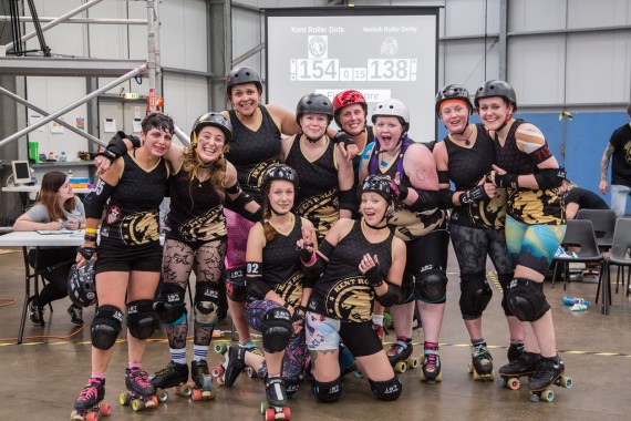 The team are all smiles after securing promotion