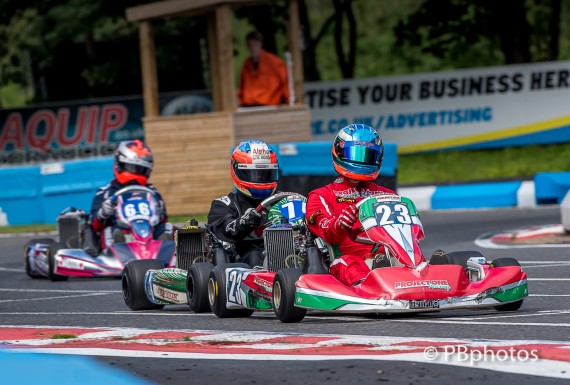 Elliot Rice #74 hunts down Wilkes, with Brough behind in third.