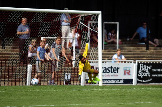FT9C0009 - Sam Higgins's shot beats Wes Foderingham to open the scoring for Bromley